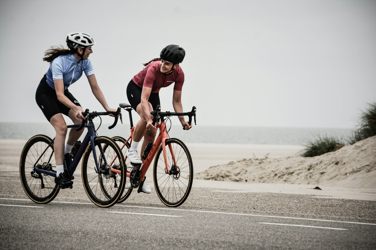 Cyclists riding mountain road together
