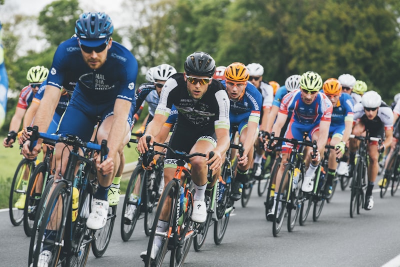 Road cyclists racing in peloton
